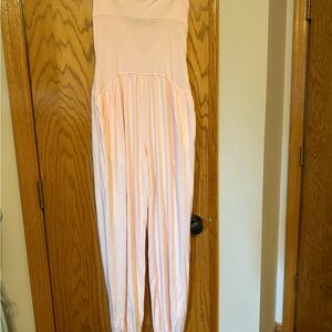 Never worn Light Pink Strapless Jumpsuit size small stretchy with pockets